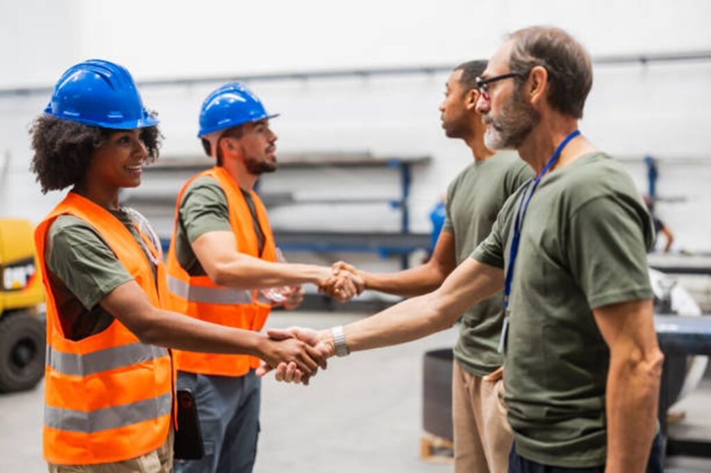 Tree service professionals shaking hands with clients during a project discussion in Beachwood, OH